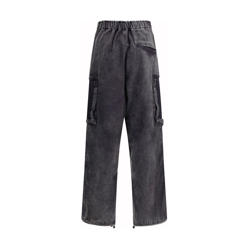Maison Mihara Yasuhiro baggy cotton pants with adjustable drawstring waistband, front zipper closure, welt pockets, and side monogram patch.