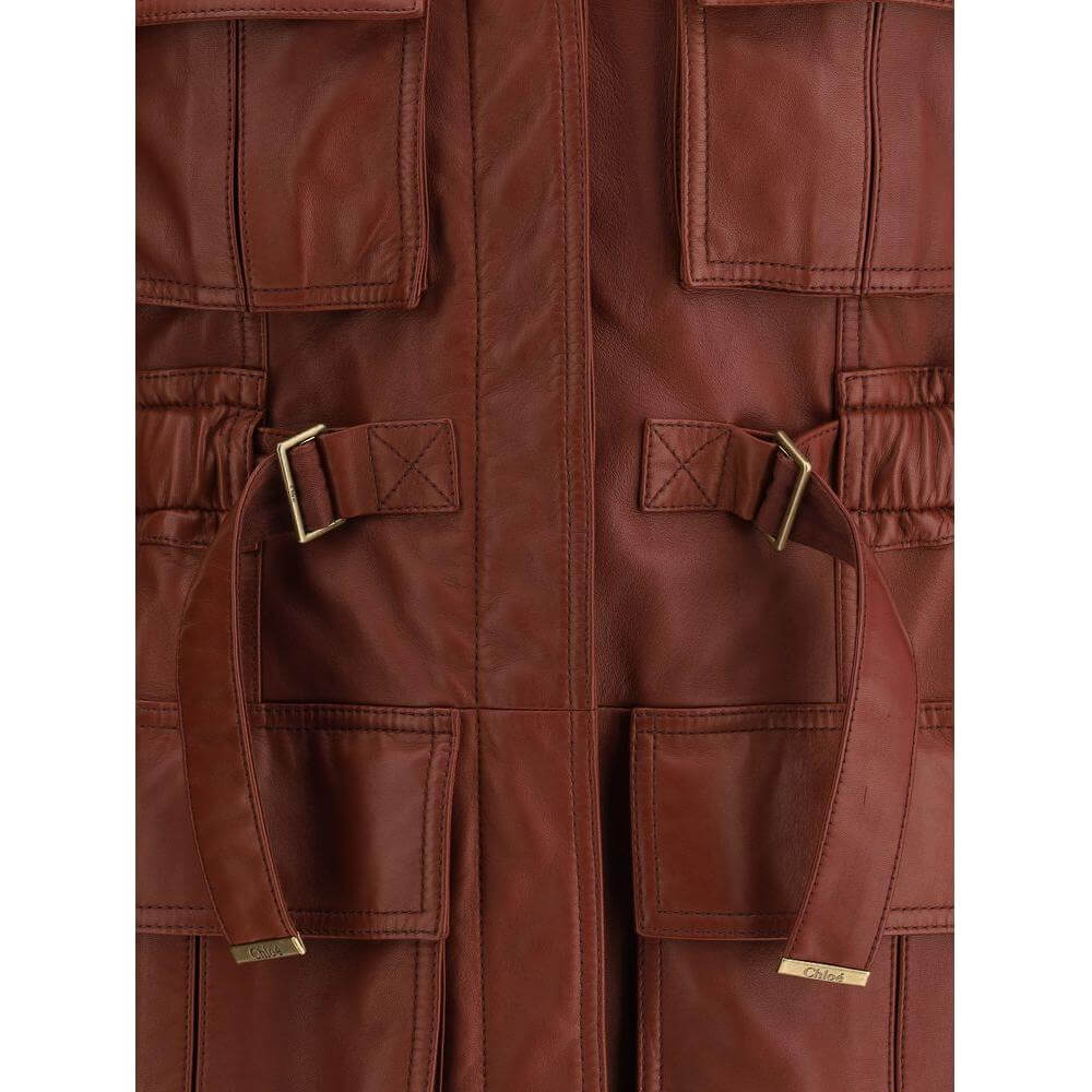 Chloé Leather Vest with V-neckline, concealed buttons, and four flap pockets featuring a metal logo triangle detail.