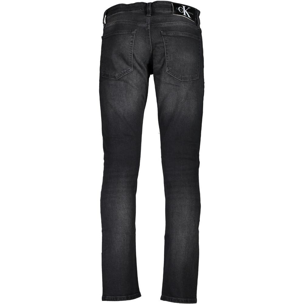 Back view of Calvin Klein black cotton jeans, slim fit with five pockets and washed effect, featuring zip and button closure with logo.