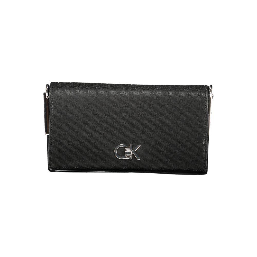 Calvin Klein black polyester women's handbag with logo and twist closure, featuring spacious compartments and elegant contrasting details.