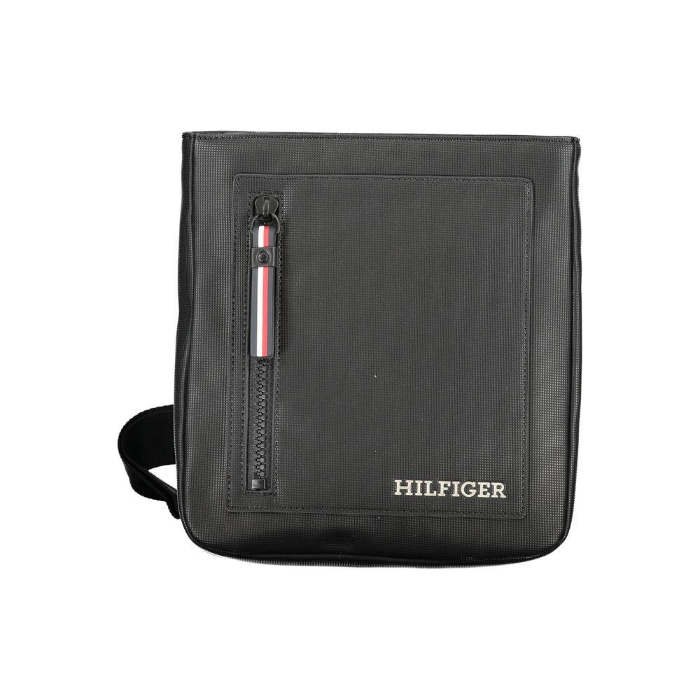 Tommy Hilfiger black shoulder bag with adjustable strap, external pocket, contrasting details, and zip closure.