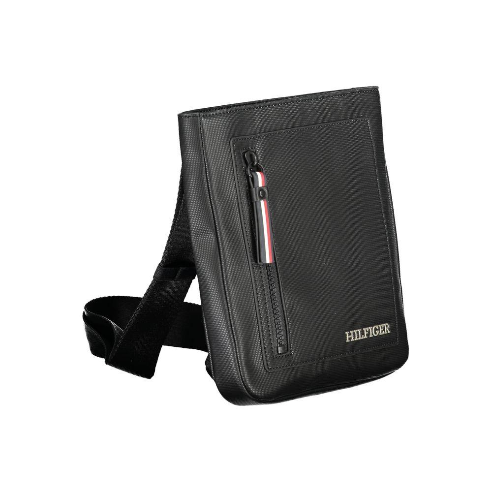 Tommy Hilfiger black polyethylene shoulder bag with adjustable strap, external and internal pockets, contrasting details, and zip closure.