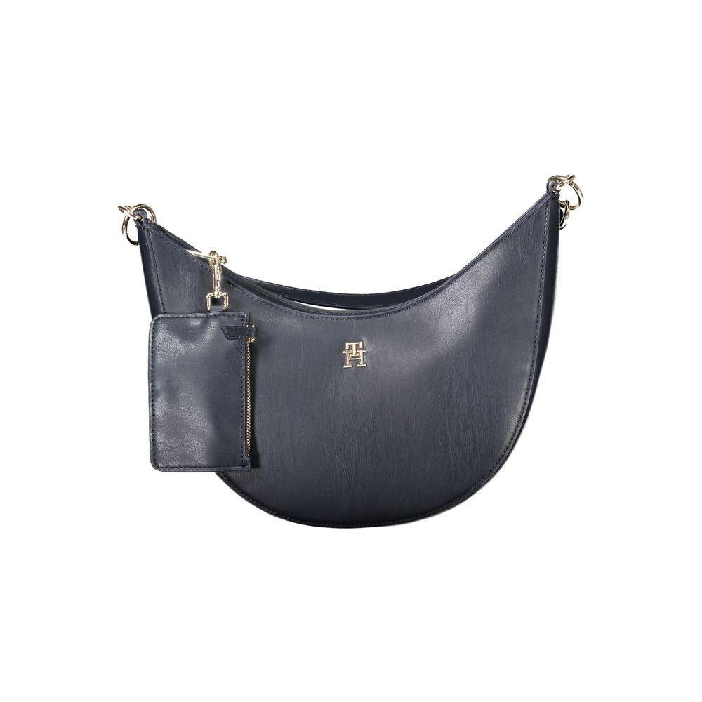 Tommy Hilfiger blue polyethylene women's handbag with detachable coin purse and adjustable strap, featuring a secure zip closure.