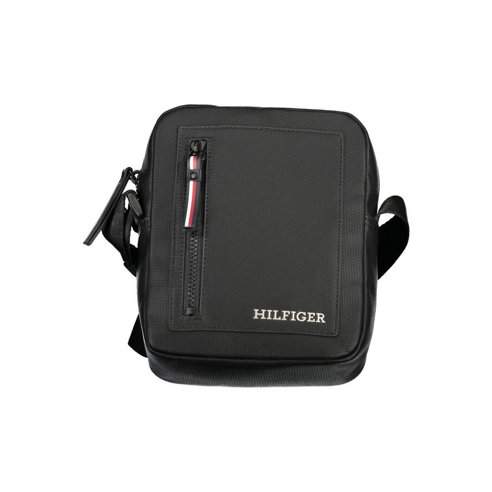 Tommy Hilfiger black polyethylene shoulder bag with adjustable strap, zip closure, logo, and contrasting details.