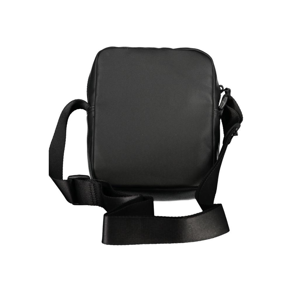 Tommy Hilfiger black shoulder bag with adjustable strap, featuring one external and one internal pocket, contrasting details, and zip closure.