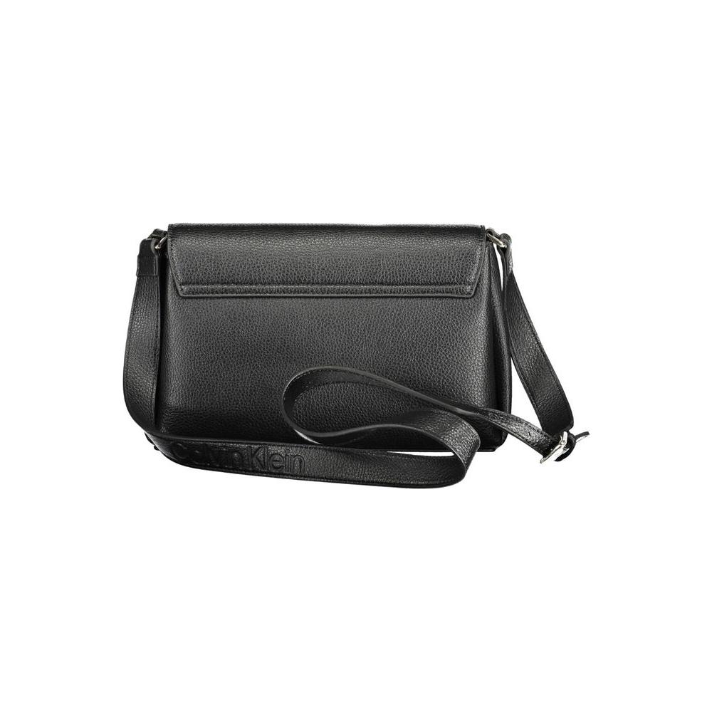 Calvin Klein black polyester women's handbag with adjustable shoulder strap and internal pocket, featuring iconic logo and sleek design.