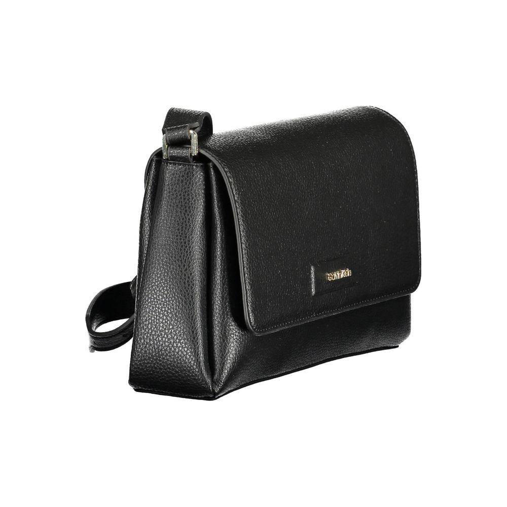 Calvin Klein black polyester women's handbag with adjustable strap, eco-friendly design, and sleek snap closure.