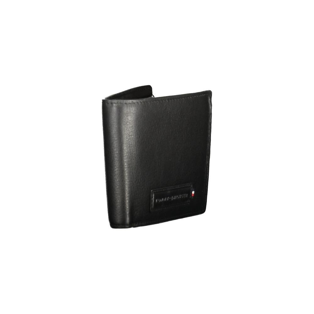Tommy Hilfiger black leather men's wallet with dual compartments, coin purse, and card slots, featuring chic contrasting details.