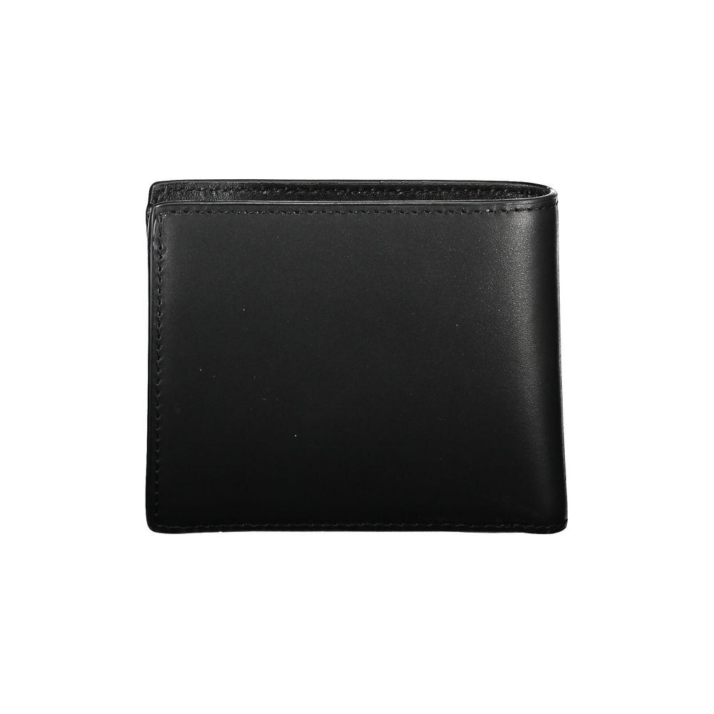 Tommy Hilfiger sleek black leather wallet for men with compartments, coin purse, and card slots, featuring iconic logo.