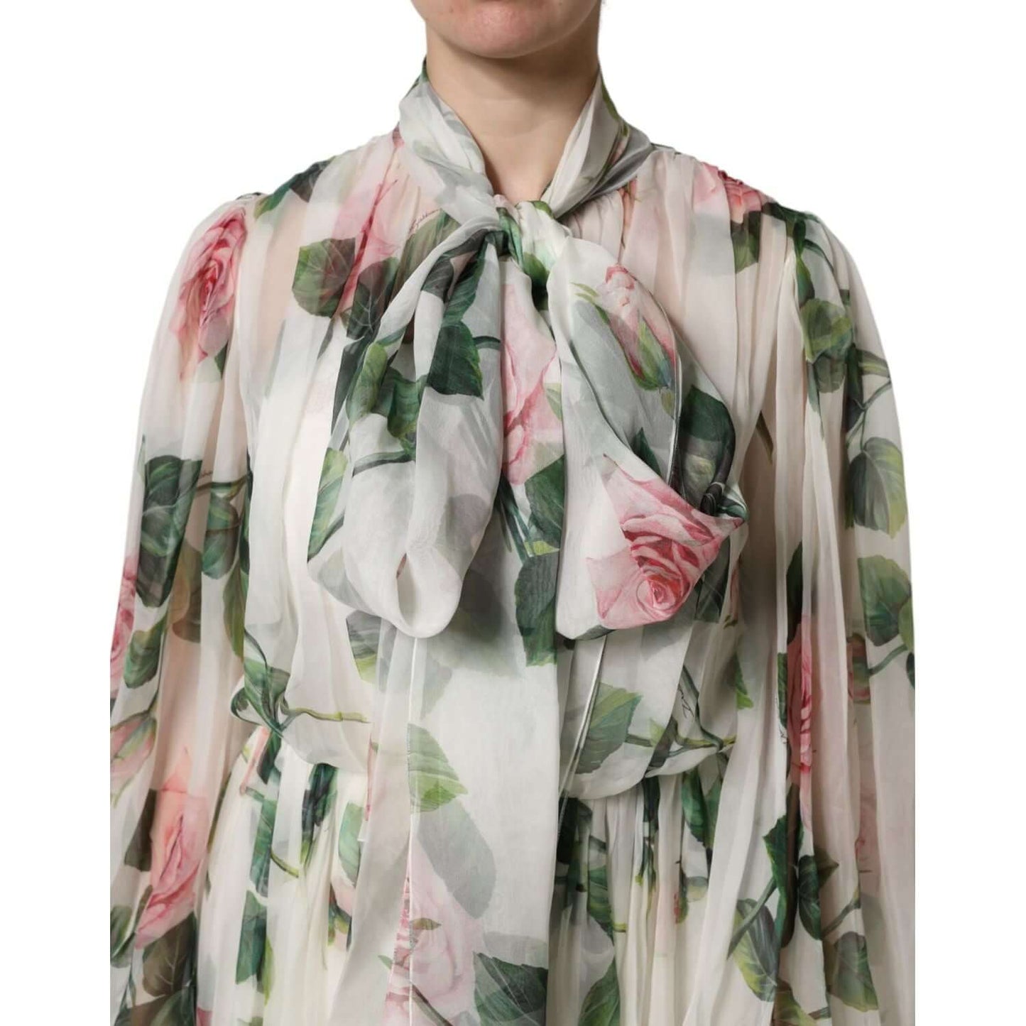 Dolce & Gabbana white floral maxi dress with roses print, featuring ribbon neckline and sheer sleeves.