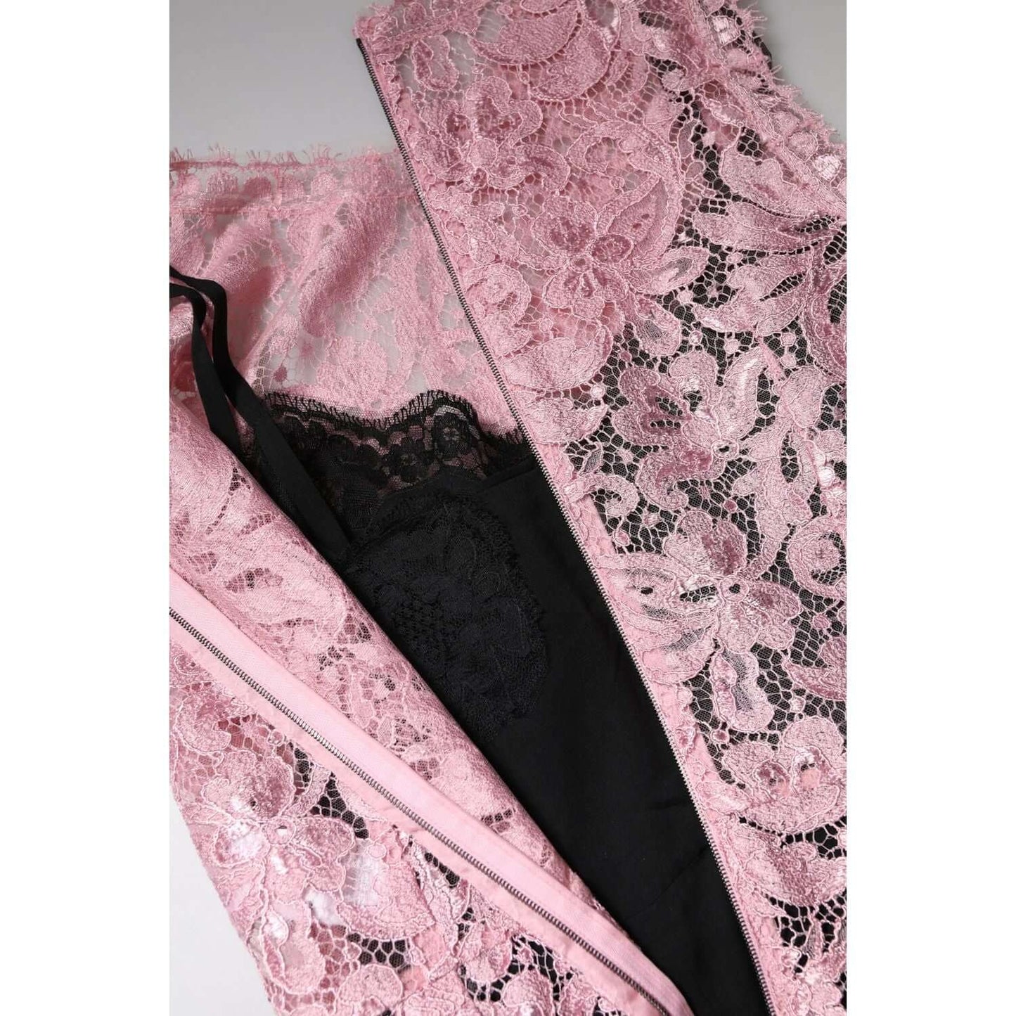Dolce & Gabbana pink floral lace sheath dress, close-up view of intricate lace and black lining, showcasing high craftsmanship.