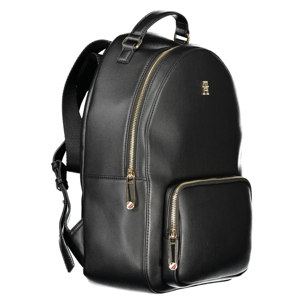 Tommy Hilfiger black polyethylene women's backpack with gold zippers, external pocket, and adjustable straps for style and functionality.
