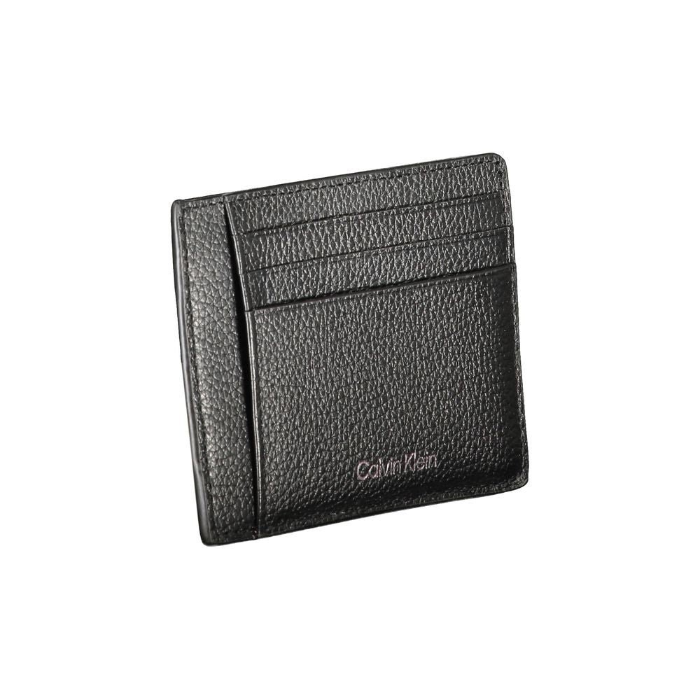 Calvin Klein black leather wallet with 2 compartments, coin purse, card spaces, and logo.