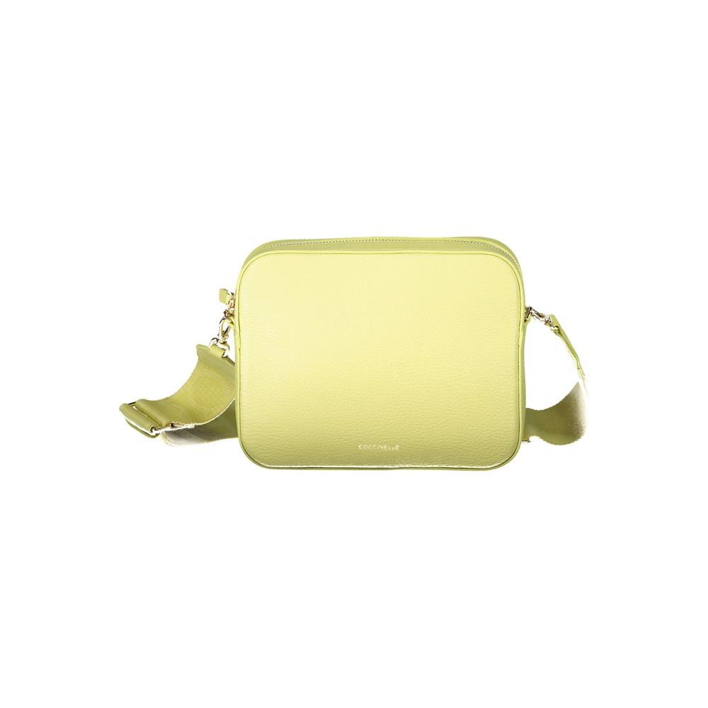Coccinelle yellow leather handbag with adjustable strap, external and internal pockets, zip and swivel closure.