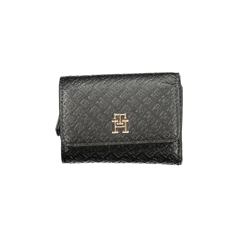 Tommy Hilfiger black polyethylene women's wallet with embossed pattern and gold logo detail, featuring secure closures.