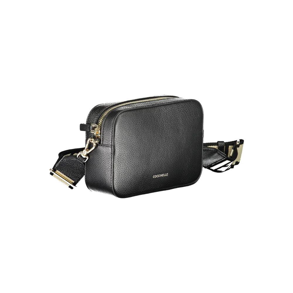 Coccinelle black leather handbag with adjustable shoulder strap, contrasting details, and zip closure.