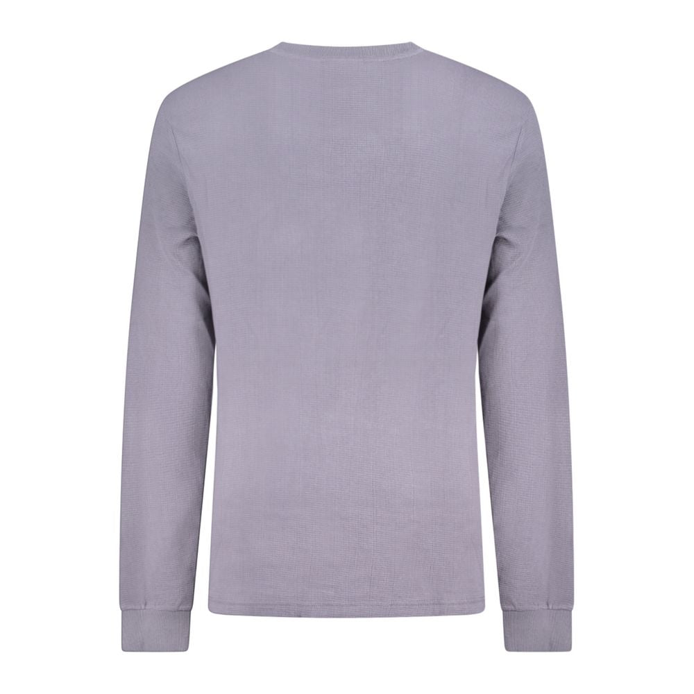 Back view of a Calvin Klein blue cotton men's sweater with long sleeves and ribbed cuffs, showcasing minimalist and sophisticated style.