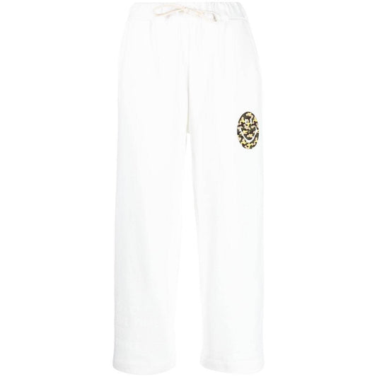 White Joshua Sanders trousers with front graphic print, elastic waistband, side slip pockets, and wide leg design.