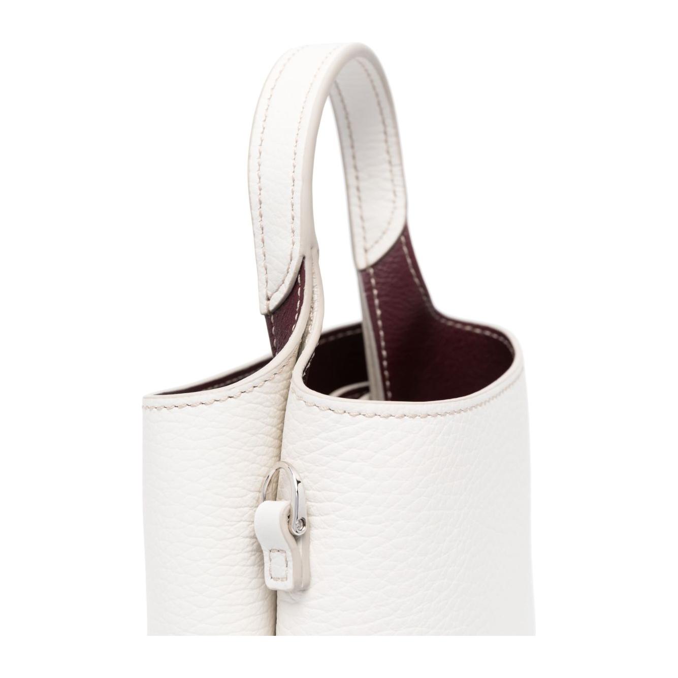 Front view with bag zipped and handles upright.