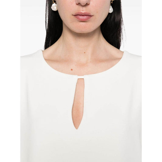 Alberto Biani white blouse with teardrop opening, three-quarter sleeves, and drop shoulders. Model is wearing size 40 (IT).