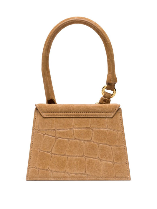 Jacquemus Le Chiquito Moyen Boucle tote bag in camel brown with embossed crocodile effect, detachable shoulder strap, and media buckle.
