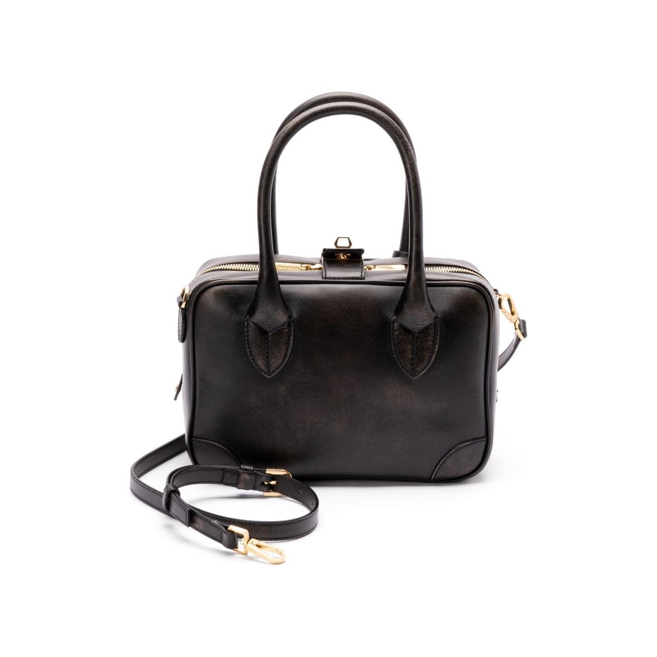 Front view with bag zipped and handles upright.