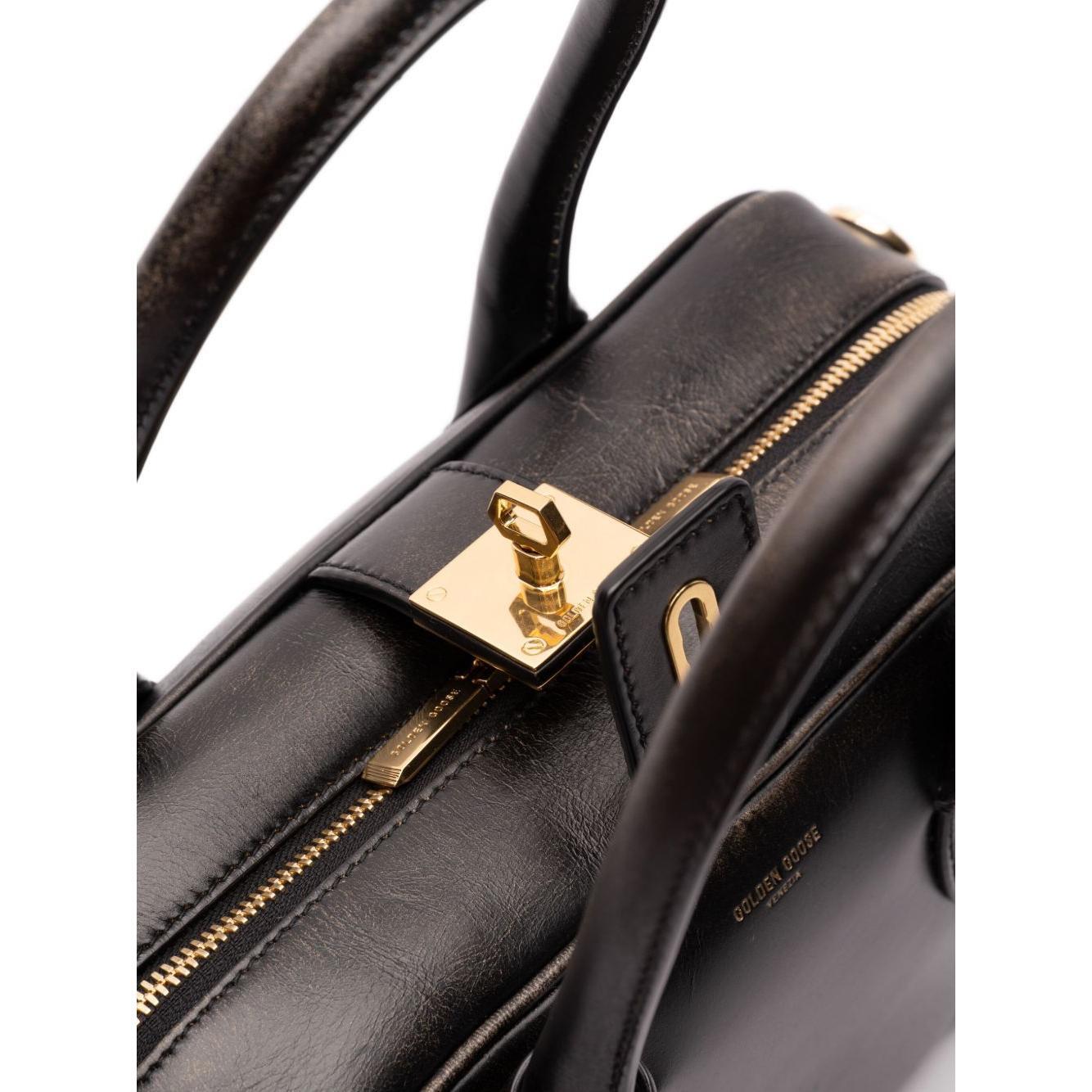Front view with bag zipped and handles upright.