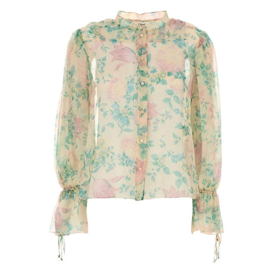 Chloè light beige silk blouse with floral print, button fastening, band collar, tied cuffs, balloon sleeves, and front buttons.