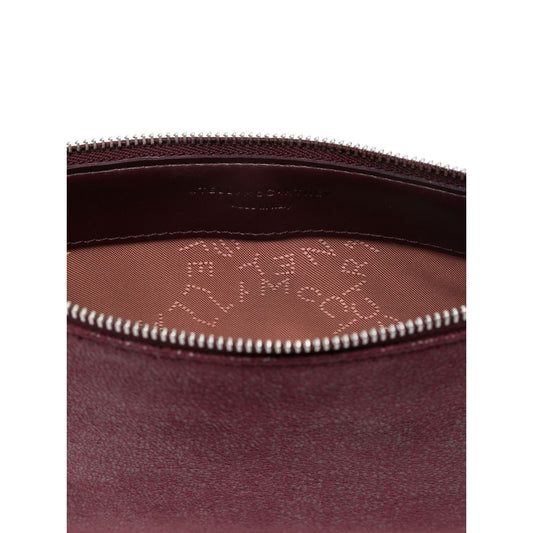 Interior view of Stella McCartney Falabella clutch in amaranth purple with logo-jacquard lining and top zip fastening.