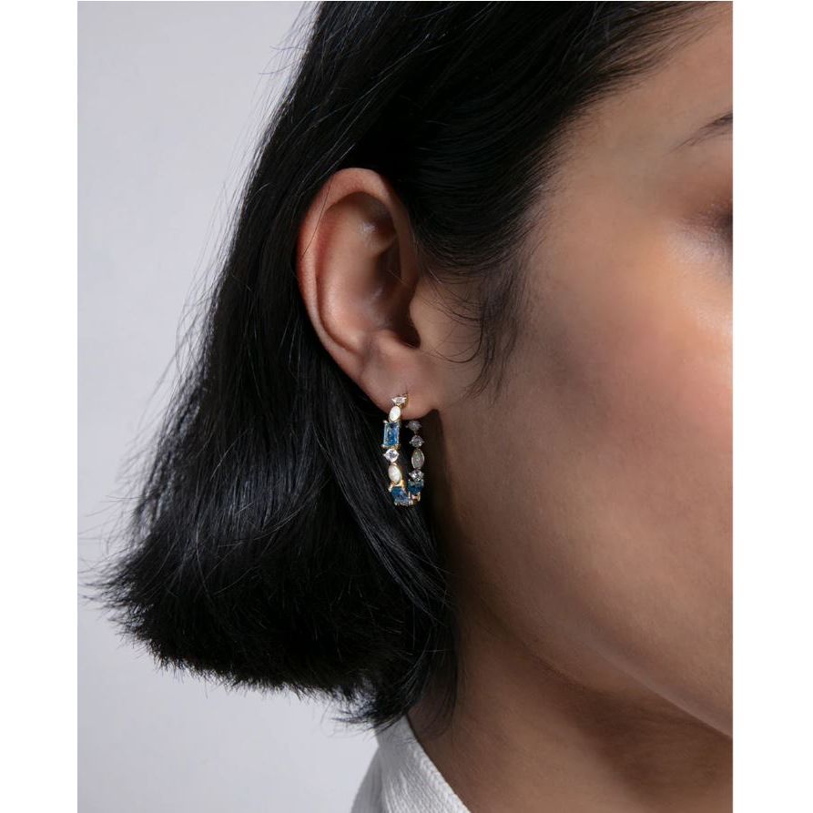Woman wearing VICEROY JEWELS Mod. 2301E100-33 silver 925° earrings in quartz analog style, close-up on ear.
