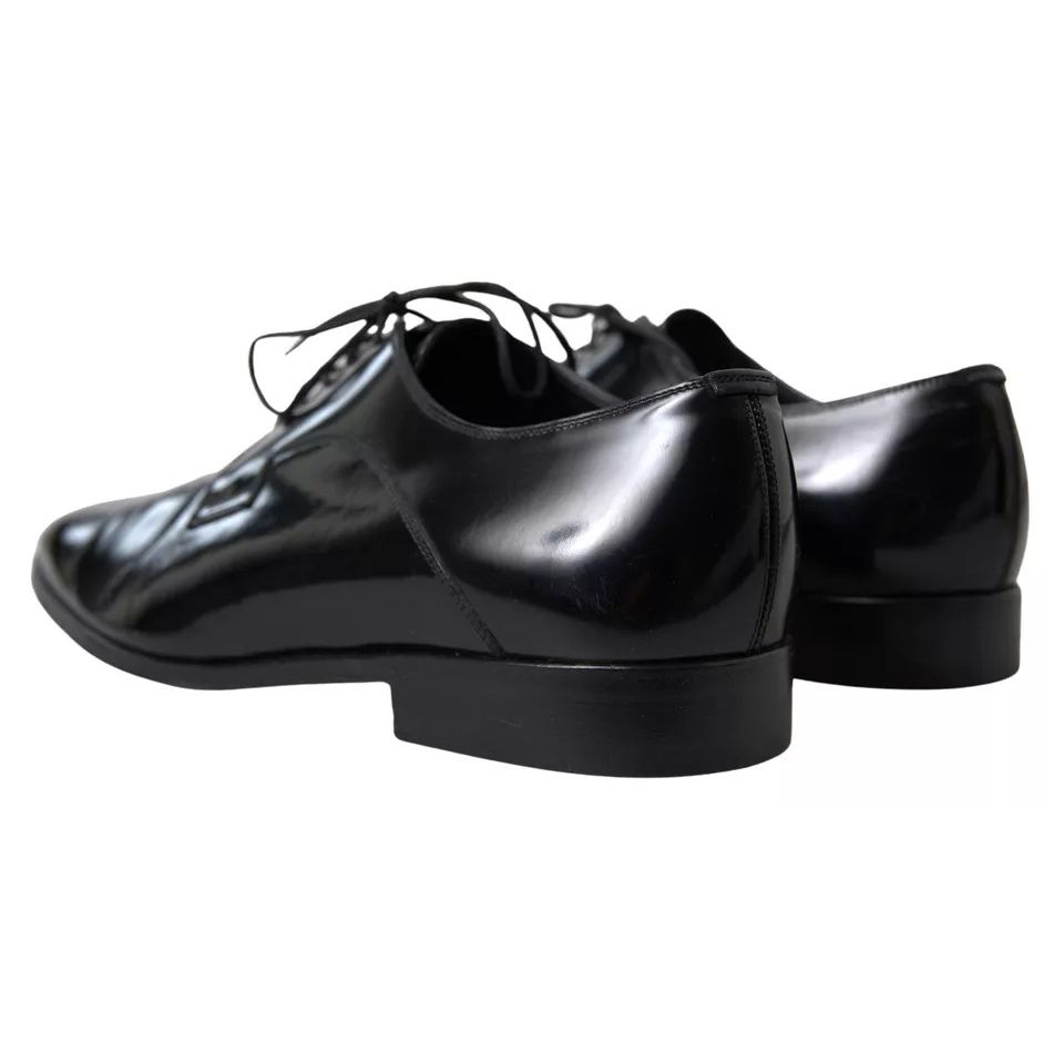 Dolce & Gabbana Black Polished Leather Formal Dress Shoes with logo details, showcasing elegant craftsmanship, slightly preowned condition.