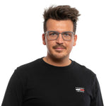 Man wearing Police Gray Men Glasses Frame with square full-rim metal and plastic design, suitable for a modern look.