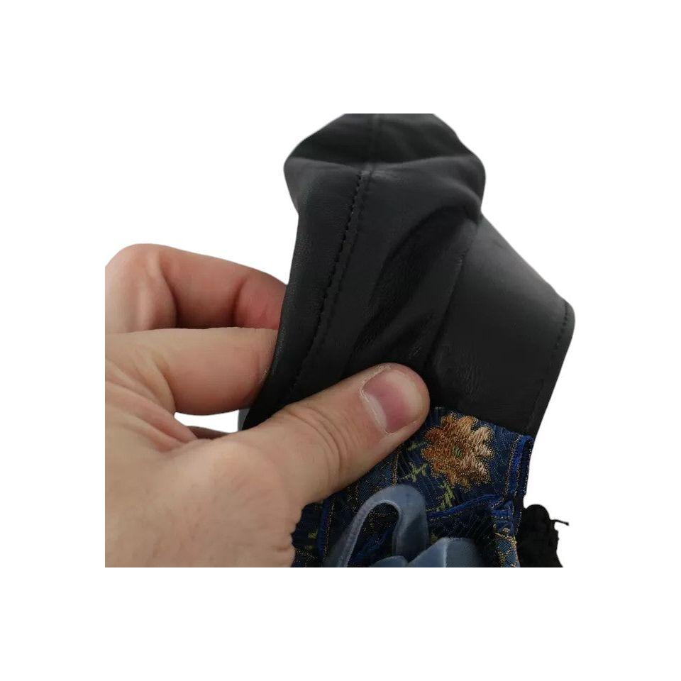 قبعة عازف الكمان من دولتشي آند غابانا مصنوعة من الجلد الأسود ومزينة بحبات الكريستال وشريط ذهبي