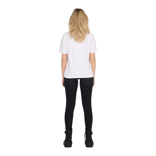 Back view of woman wearing white cotton t-shirt from spring/summer collection with black pants