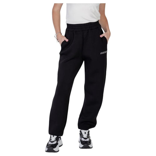 Woman wearing Guess Active Cecilia Scuba Jogger black sports pants with elastic waistband, side pockets, and sneakers.