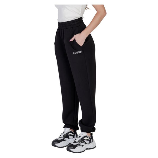 Woman wearing Guess Active Cecilia Scuba Jogger pants in black, showcasing sporty style with elastic waistband and side pockets.