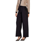 Woman wearing ICHI Black Polyester Pant with wide-leg design and elegant style.