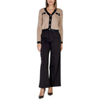 Woman wearing ICHI Black Polyester Pant with buttoned cardigan