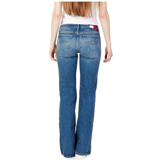 Woman wearing Tommy Hilfiger women's baggy blue jeans, made from cotton and recycled cotton, fall/winter collection, rear view.