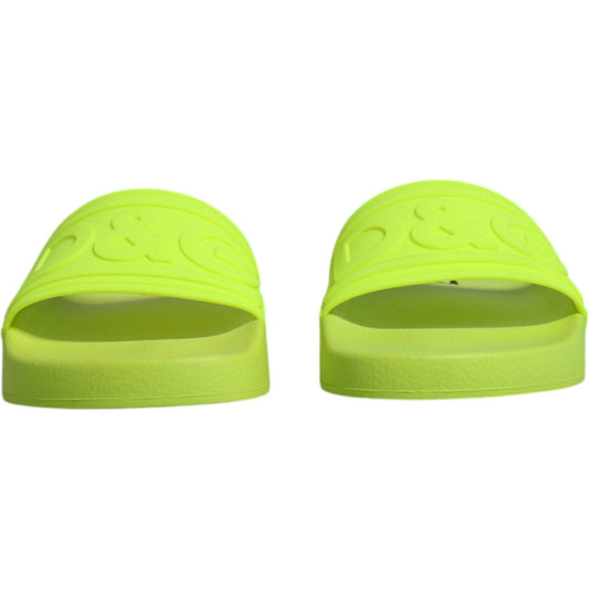 Dolce & Gabbana neon green rubber slides sandals, slip-on beachwear shoes with logo, made in Italy, high-quality comfort.