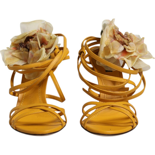 Dolce & Gabbana yellow Keira sandals with floral appliques, adjustable straps, leather sole, and stiletto heel. Made in Italy.