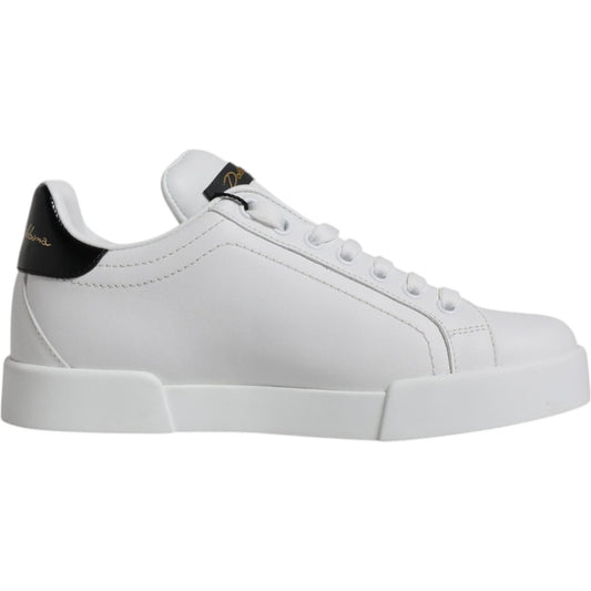 Dolce & Gabbana white leather low top sneakers with black accents, rubber sole, and lace-up closure, made in Italy.