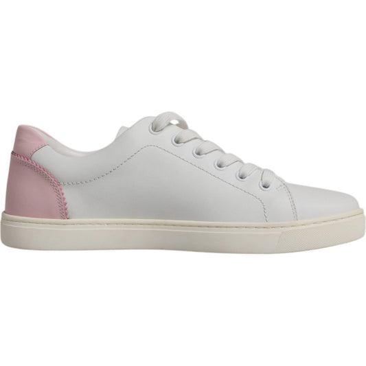 Dolce & Gabbana white calf leather sneakers with pink heel, rubber sole, and lace-up closure. High quality Italian shoes.