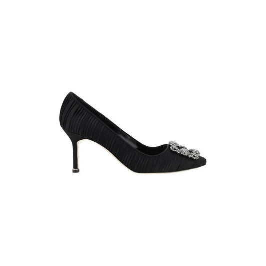 Manolo Blahnik Hangisi Pump in black silk satin with Swarovski crystal buckle and stiletto heel, elegant luxury shoe.