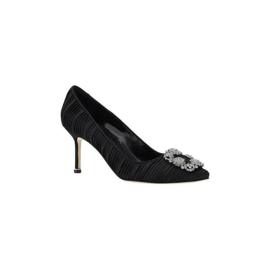 Manolo Blahnik Hangisi Pumps in black silk satin with Swarovski crystal buckle and leather stiletto heel for timeless elegance.