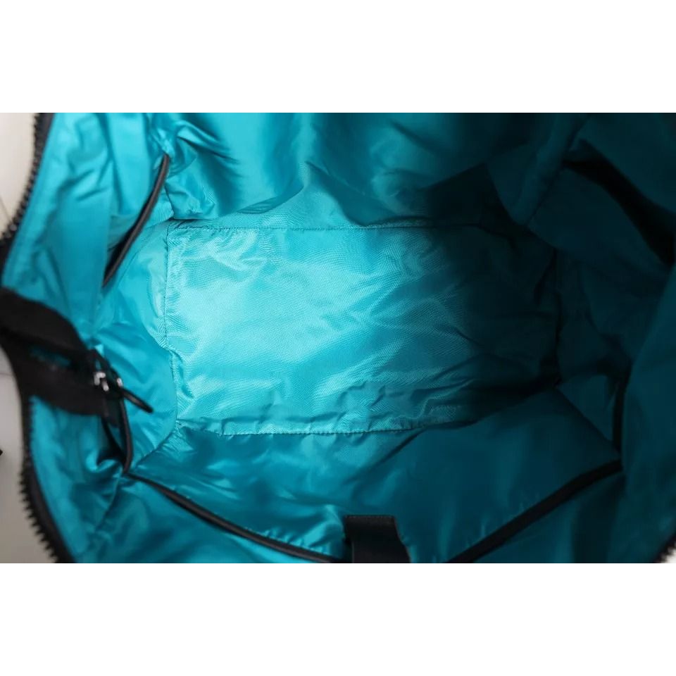 Front view with bag zipped and handles upright.