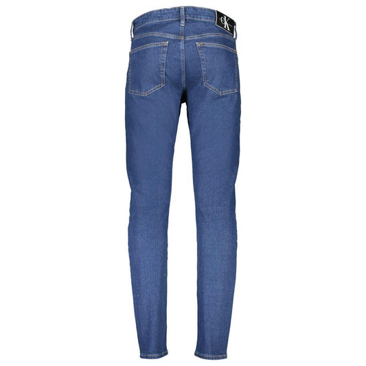 Back view of Calvin Klein blue slim taper jeans with 5 pockets and logo. Made with 20% recycled cotton.
