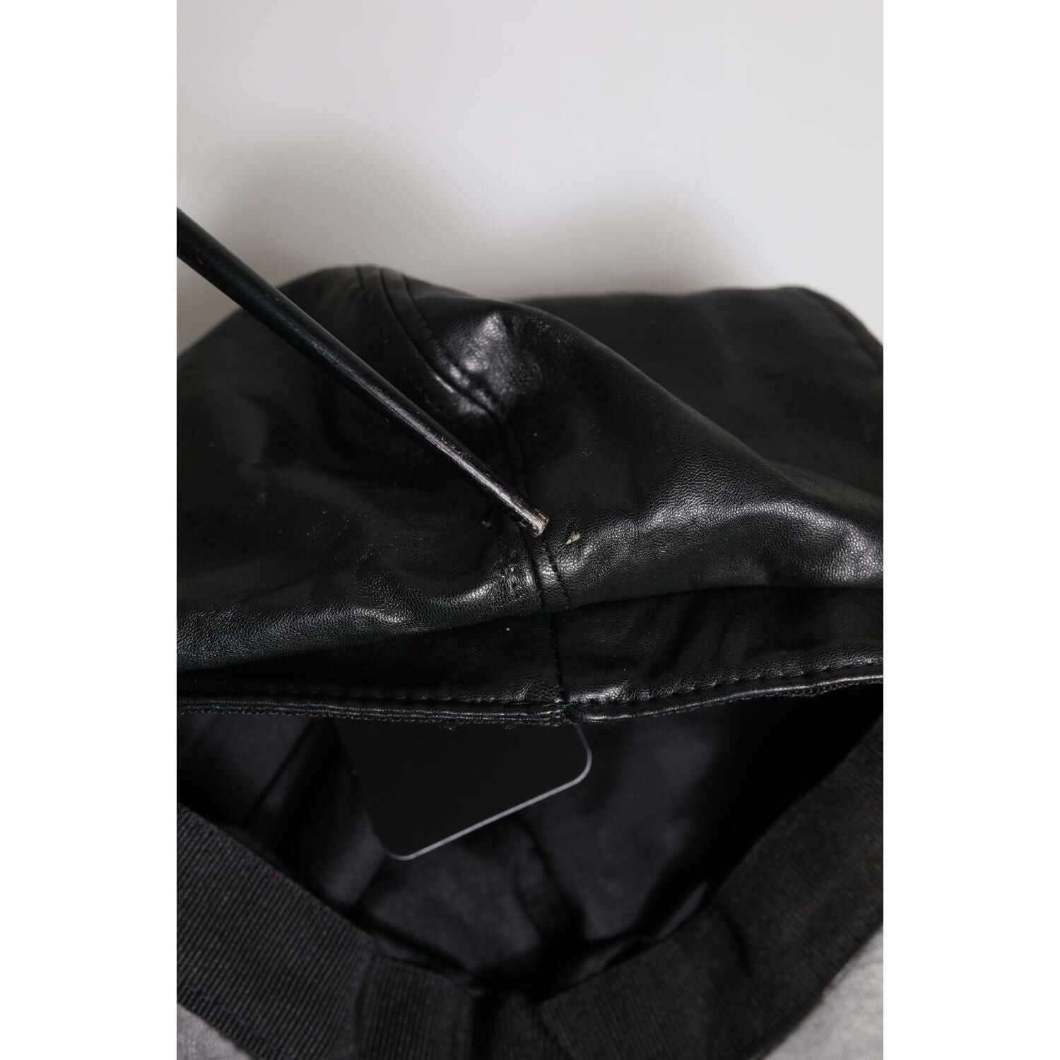 Front view with bag zipped and handles upright.
