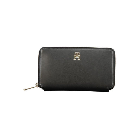 Tommy Hilfiger black polyethylene wallet with 4 compartments, coin purse, card slots, zip closure, and logo design