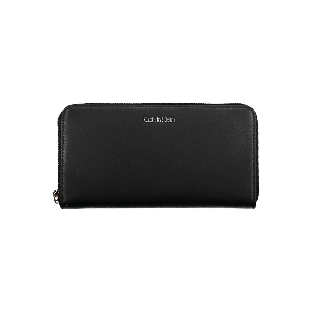 Calvin Klein Black Polyethylene Wallet with zip closure and logo, featuring 5 compartments, coin purse, and card spaces.